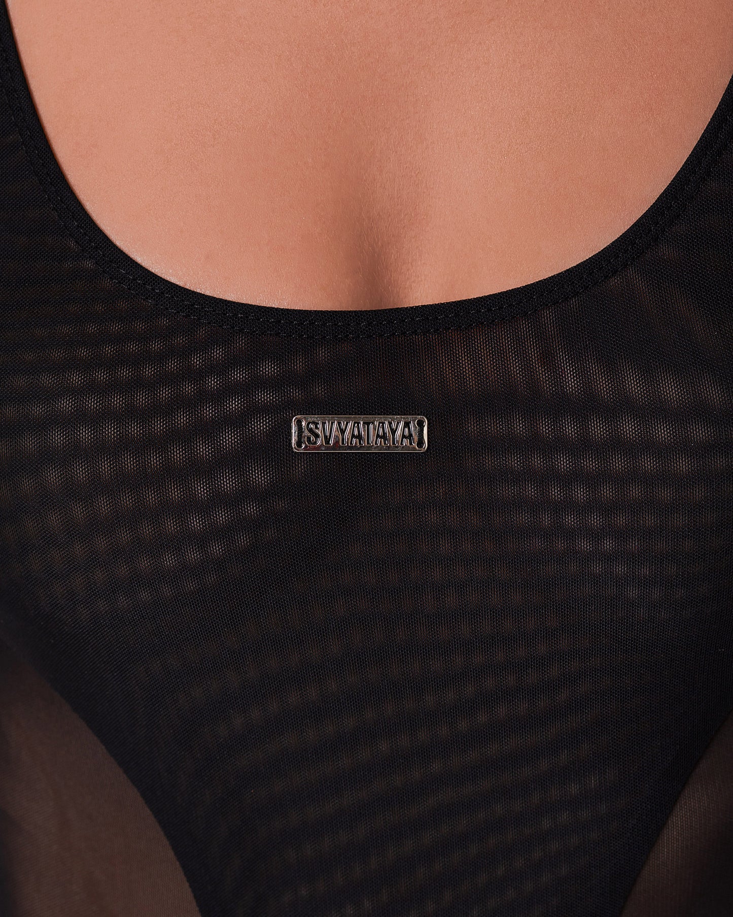 Luxurious mesh bodysuit with sculpted detailing