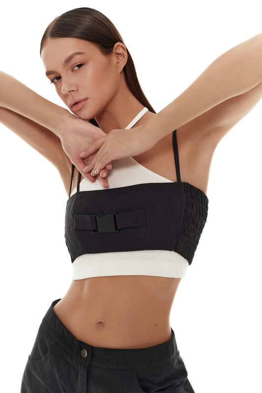 Elegant black top with refined contrasting detailing